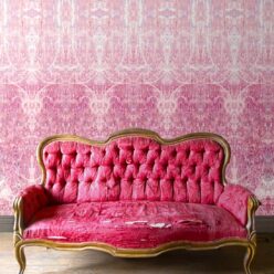 Hori Wallpaper by Simcox • Color Rose • Abstract Wallpaper • insitu with a pink sofa